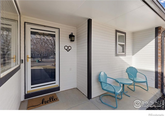 entrance to property featuring covered porch