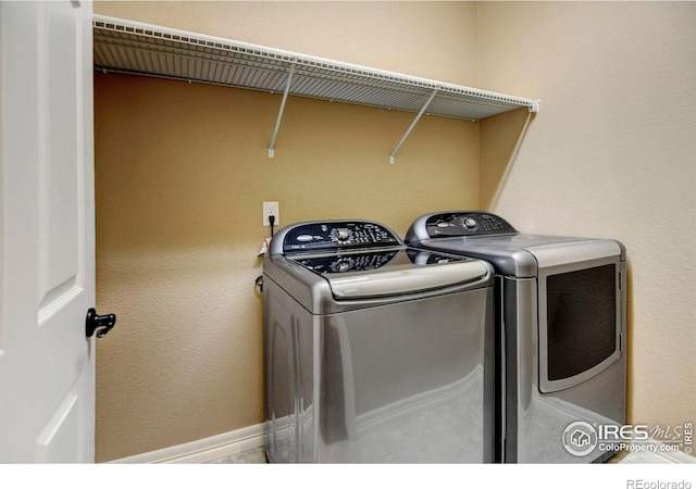 laundry area featuring laundry area and washing machine and clothes dryer