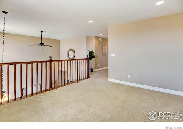 empty room with baseboards, carpet floors, ceiling fan, and recessed lighting