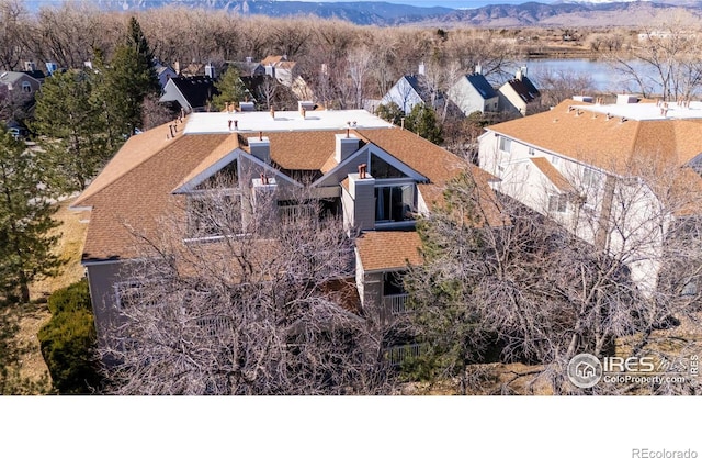 birds eye view of property featuring a mountain view