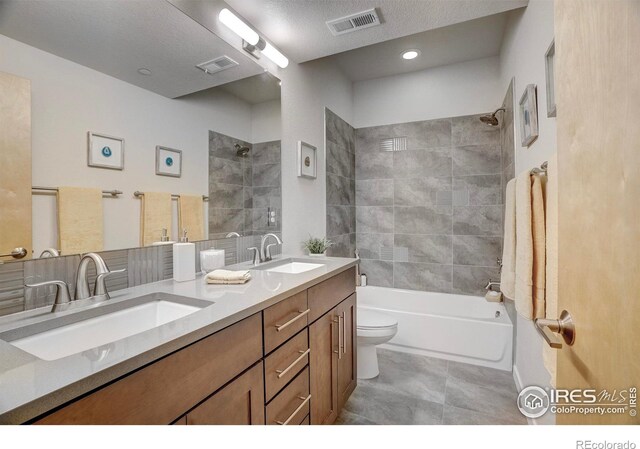 full bathroom featuring visible vents, a sink, and bathing tub / shower combination