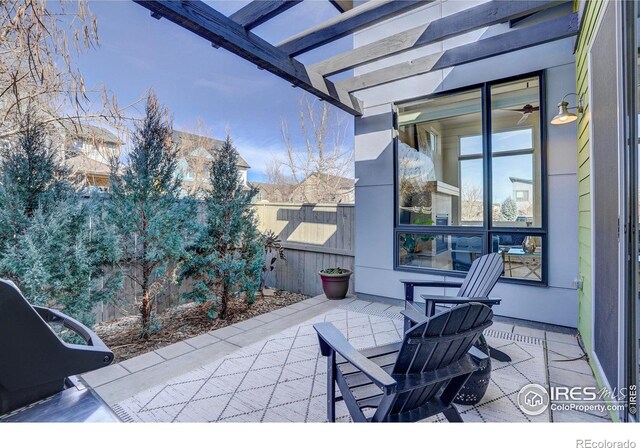 view of patio with fence and a pergola