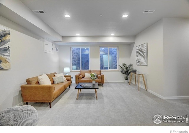 carpeted living room with recessed lighting, visible vents, and baseboards