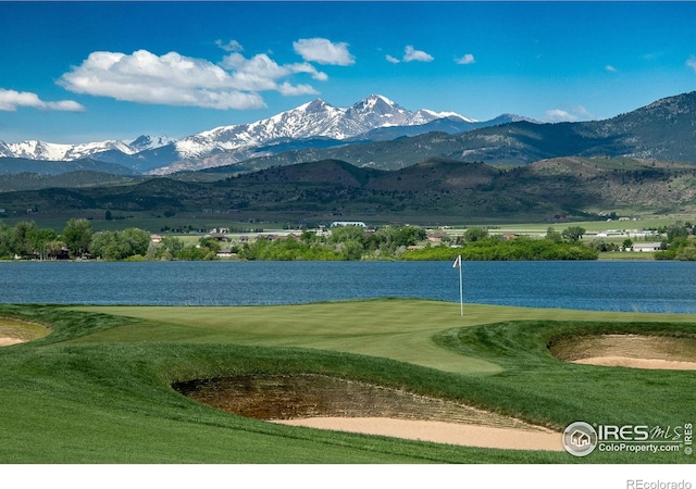 2748 Prairie Flax St, Berthoud, CO 80513 - view of home's community featuring golf course view, a yard, and a water and mountain view