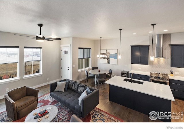 2748 Prairie Flax St, Berthoud, CO 80513 - living room with ceiling fan, recessed lighting, baseboards, and dark wood finished floors