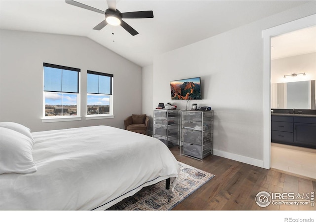 2748 Prairie Flax St, Berthoud, CO 80513 - bedroom with dark wood finished floors, ensuite bath, a ceiling fan, lofted ceiling, and baseboards