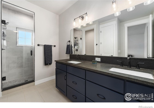 2748 Prairie Flax St, Berthoud, CO 80513 - bathroom featuring a sink, tile patterned flooring, baseboards, and a stall shower
