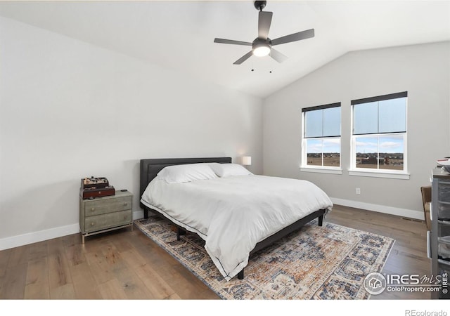 2748 Prairie Flax St, Berthoud, CO 80513 - bedroom featuring wood finished floors, ceiling fan, baseboards, and vaulted ceiling