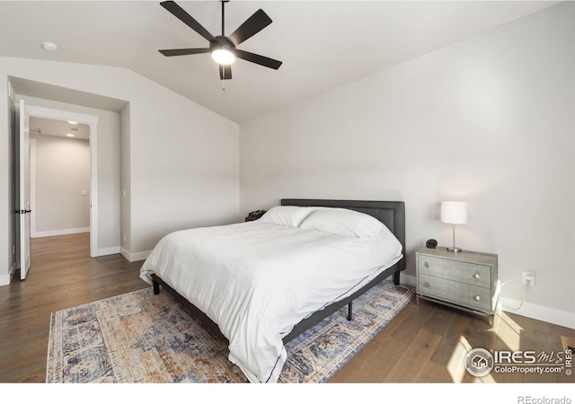 2748 Prairie Flax St, Berthoud, CO 80513 - bedroom with baseboards, hardwood / wood-style floors, and vaulted ceiling