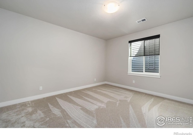 2748 Prairie Flax St, Berthoud, CO 80513 - empty room featuring visible vents, baseboards, and carpet floors