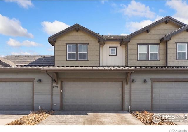 2748 Prairie Flax St, Berthoud, CO 80513 - multi unit property featuring an attached garage, a standing seam roof, metal roof, and concrete driveway