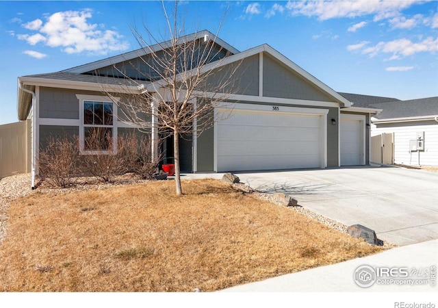 single story home with a garage and concrete driveway