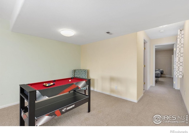 recreation room featuring carpet, visible vents, and baseboards