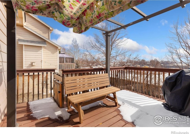 wooden deck featuring area for grilling