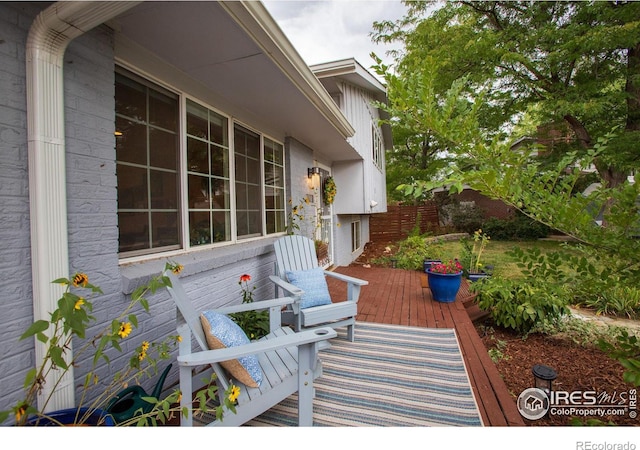 view of patio / terrace with fence and a wooden deck