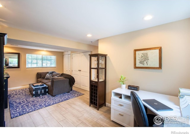 office featuring wood finish floors, baseboards, and recessed lighting