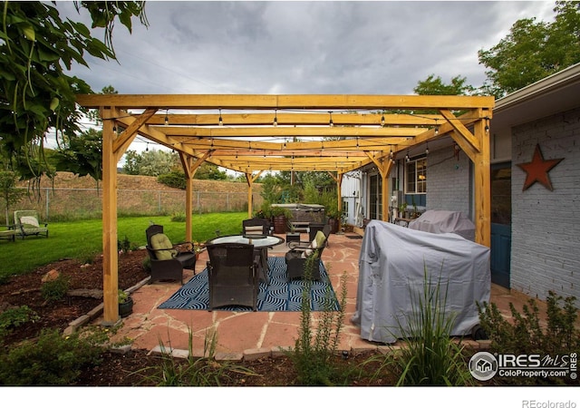 view of patio / terrace with fence and a pergola