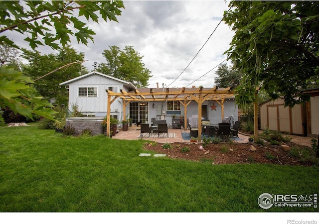 back of property featuring a yard, a pergola, board and batten siding, and a patio