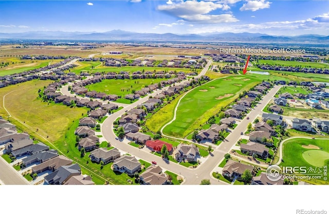 bird's eye view with a residential view, view of golf course, and a mountain view