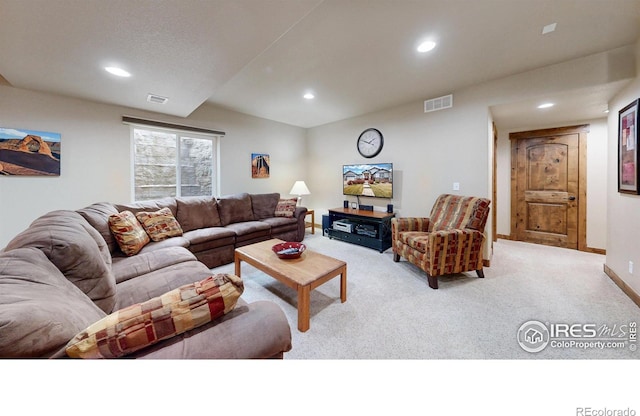 living area with recessed lighting, baseboards, visible vents, and carpet flooring