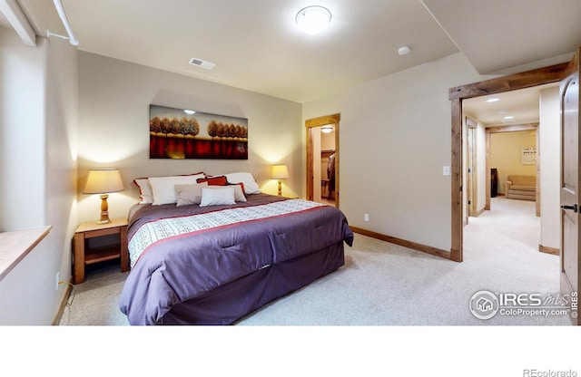 bedroom featuring carpet flooring, visible vents, and baseboards