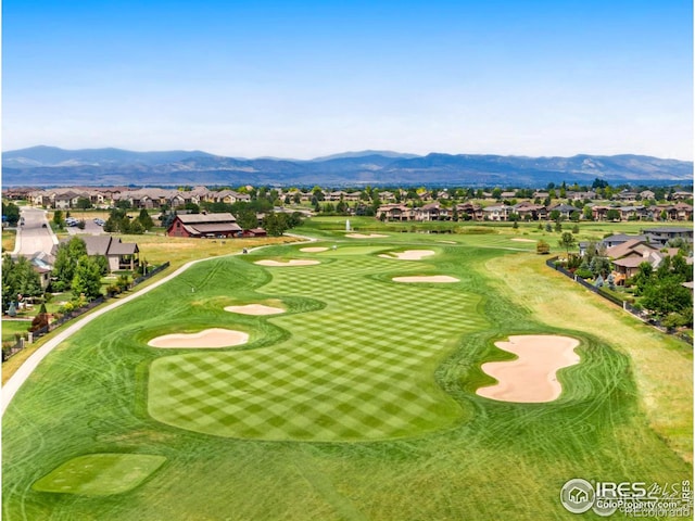 surrounding community featuring view of golf course, a residential view, and a mountain view