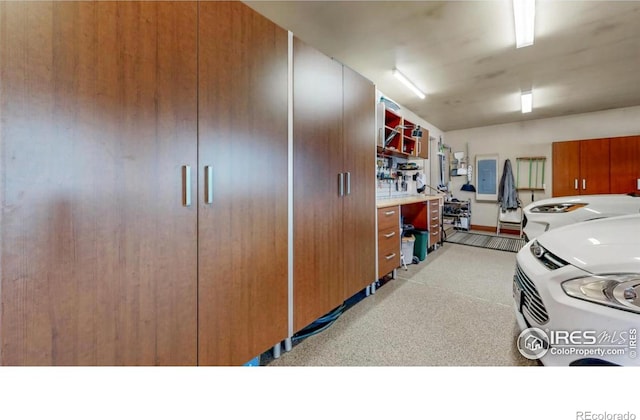 garage featuring washer / dryer and electric panel