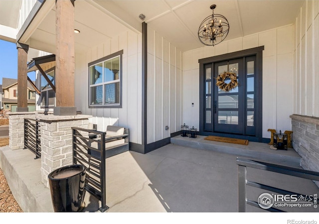 entrance to property featuring covered porch and board and batten siding