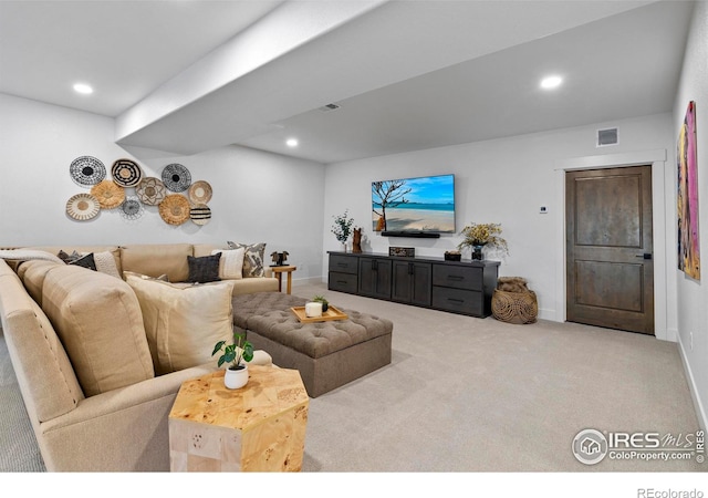 living area featuring carpet floors, recessed lighting, visible vents, and baseboards