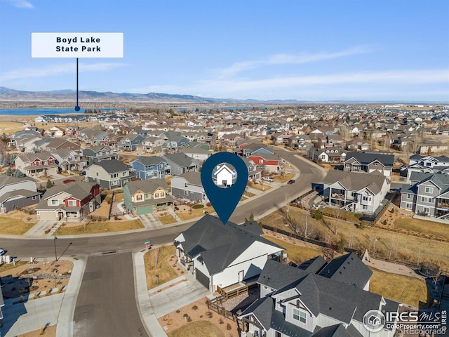 bird's eye view featuring a residential view and a mountain view