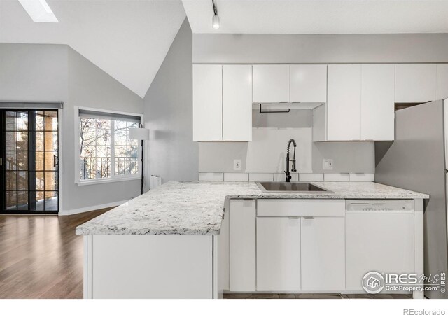 kitchen featuring a sink, dark wood-style flooring, white cabinets, and dishwasher