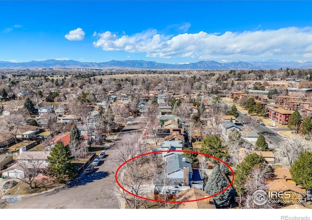 birds eye view of property with a residential view and a mountain view