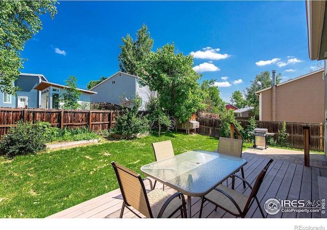 wooden terrace with a yard, outdoor dining area, a fenced backyard, and a grill