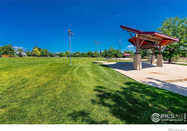 view of property's community featuring a yard and a gazebo