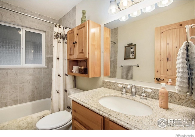 bathroom featuring shower / bath combo with shower curtain, vanity, and toilet