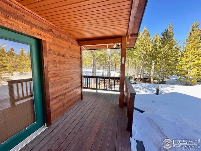 view of snow covered deck