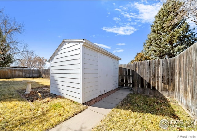 view of shed featuring a fenced backyard