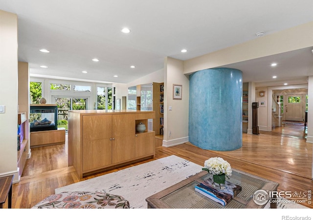 interior space with light wood-type flooring and recessed lighting