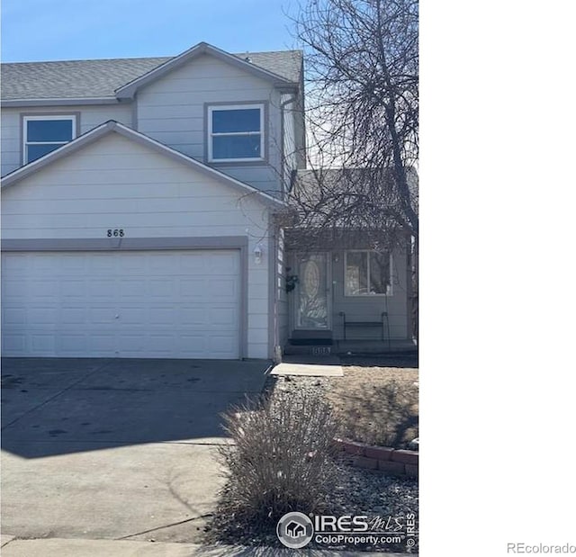 view of front of home featuring a garage and concrete driveway