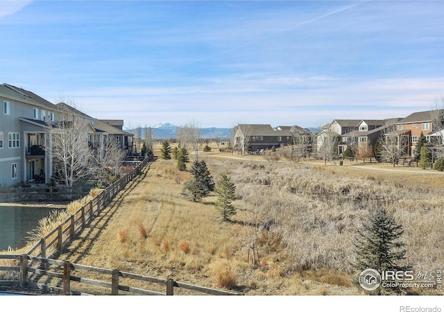 view of yard with fence and a residential view