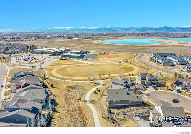 drone / aerial view featuring a residential view and a mountain view