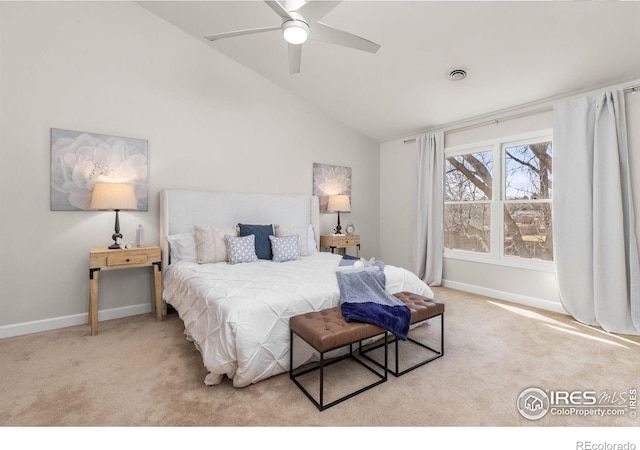 carpeted bedroom featuring visible vents, baseboards, ceiling fan, and vaulted ceiling