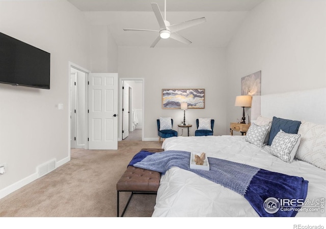 bedroom featuring visible vents, high vaulted ceiling, a ceiling fan, carpet floors, and baseboards