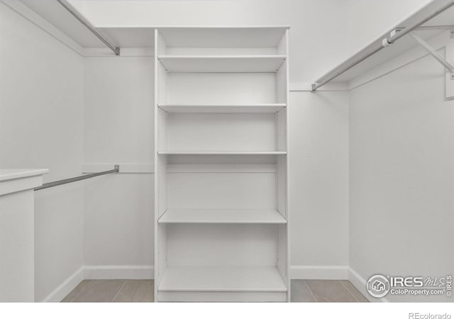 walk in closet featuring tile patterned floors