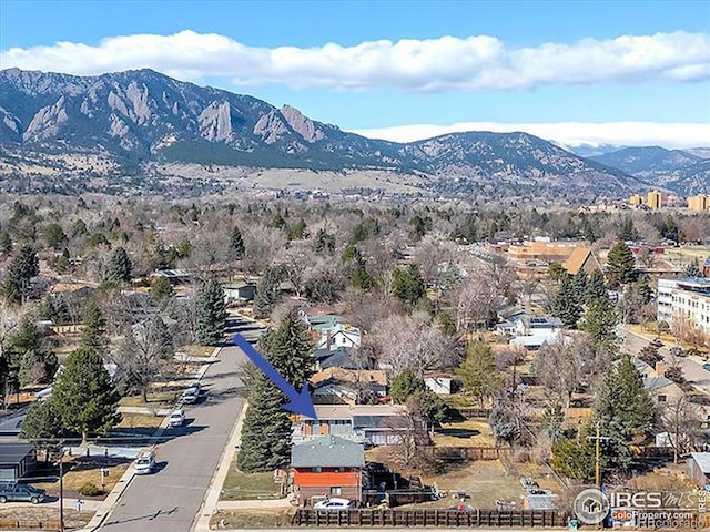 drone / aerial view featuring a mountain view