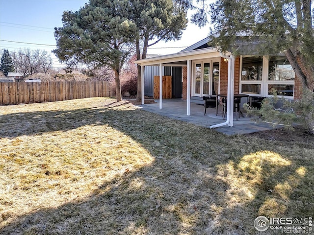 exterior space featuring fence and a patio