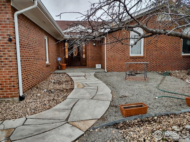 view of property exterior featuring brick siding