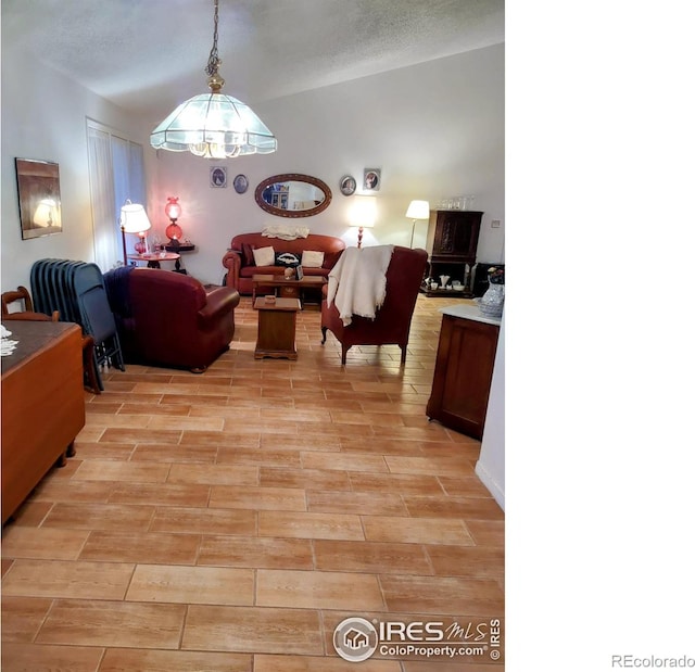 dining space with an inviting chandelier and wood tiled floor