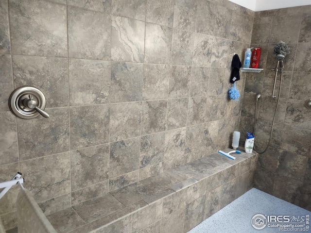 bathroom with tiled shower
