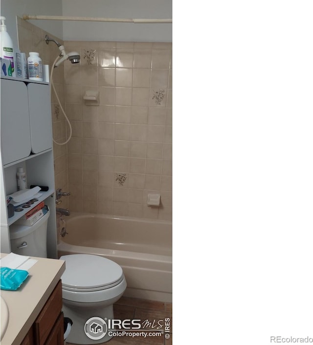 full bath with toilet, vanity, and shower / washtub combination